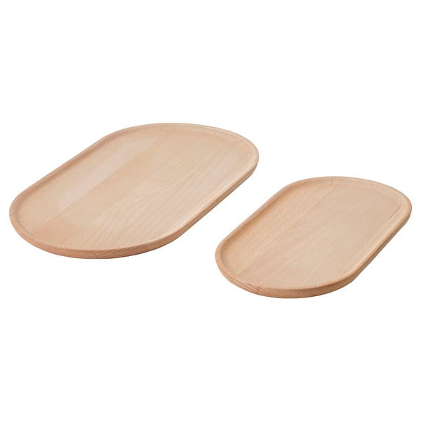 Deux plateaux en bois, brun clair, de forme ovale, surface lisse.
