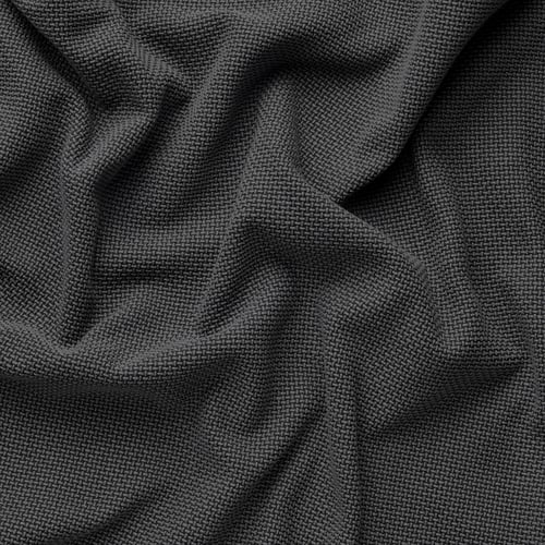 Gros plan d’un tissu tissé sombre, mettant en valeur sa texture robuste et son motif subtil.