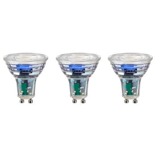 Trois ampoules led ikea identiques, blanc froid, de forme ronde avec base métallique.