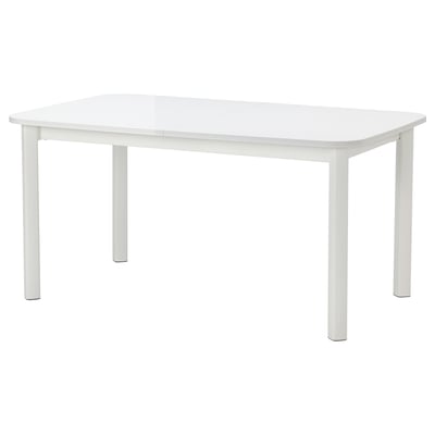 Table à manger extensible blanche STRANDTORP avec pieds en métal, design minimaliste moderne.