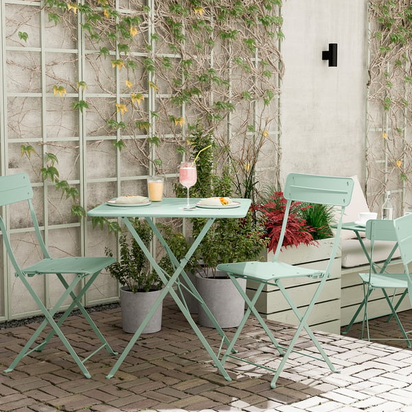 Petit ensemble de patio extérieur avec table et chaises en métal pliables vert clair. Parfait pour les balcons, livré pré-assemblé.
