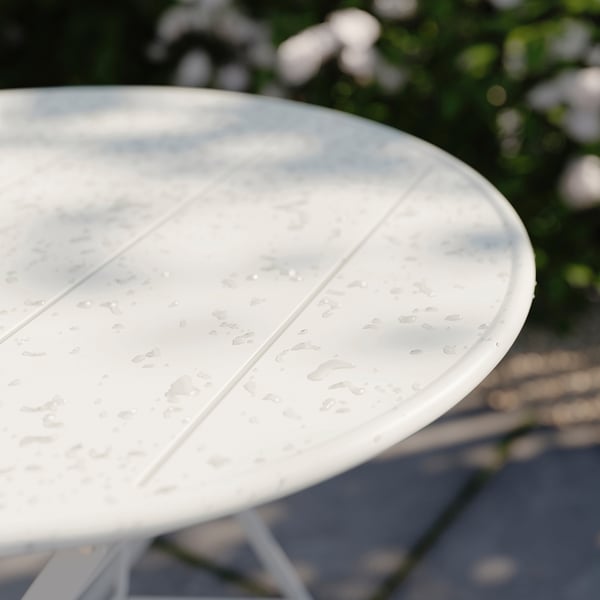 Table de jardin en métal blanc avec gouttes d’eau, ronde, utilisation en extérieur.