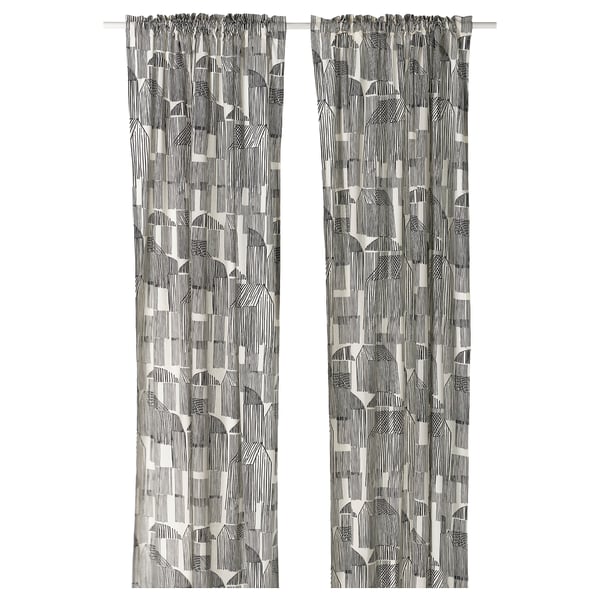 Rideaux à motifs noir et blanc avec croquis, mélange rustique de coton et de jute, suspendus droits.