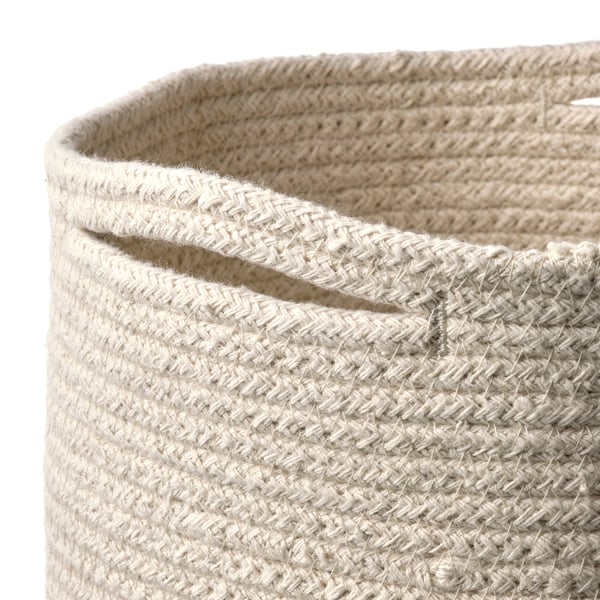 Panier en coton tissé à la main avec des motifs complexes, présentant une haute qualité et un design intemporel.