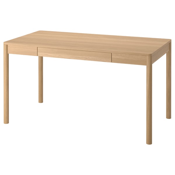 Un bureau en placage de chêne brun clair TONSTAD avec une forme rectangulaire et un design minimaliste. Il a deux tiroirs étroits et quatre pieds robustes.