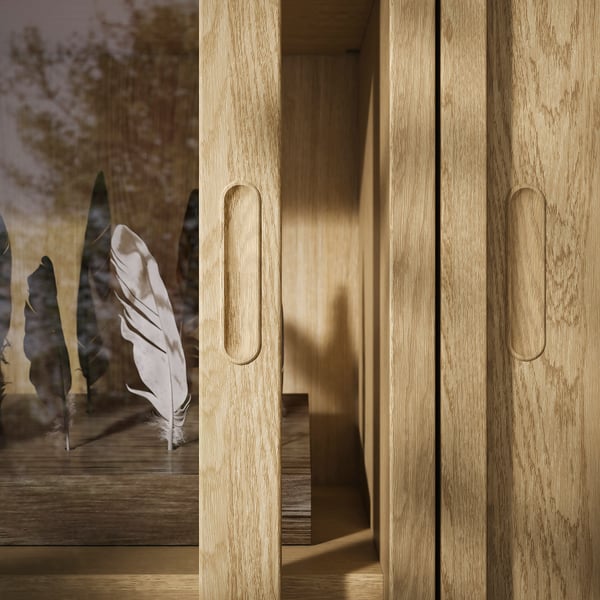 Armoire en bois avec poignées ovales élégantes et tiroirs à fermeture douce. Finition chêne brossé, lui donnant un look unique et intemporel.