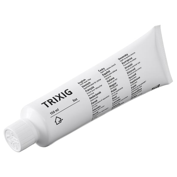 Tube de remplissage de réparation de trous TRIXIG. Multi-langues. Répare les petits trous.