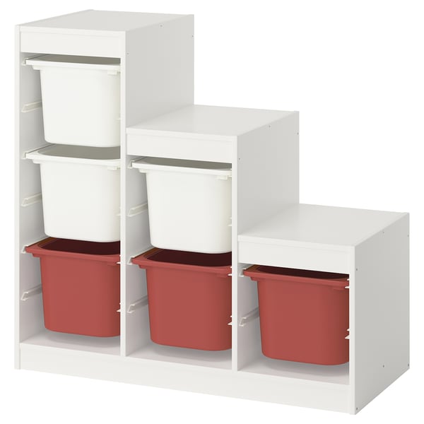 Unité de stockage TROFAST avec des bacs en plastique rouge et blanc disposés dans un cadre en bois blanc. Conception compacte et polyvalente pour l’organisation de la chambre des enfants.