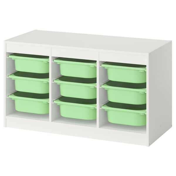 Un meuble de rangement TROFAST avec cadre blanc et caisses en plastique vertes. C’est un design bas et rectangulaire pour les chambres d’enfants.