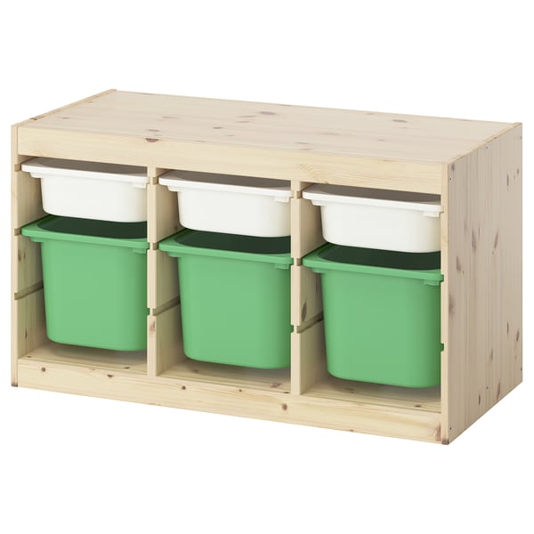 Un meuble de rangement ikea TROFAST en pin clair avec des caisses en plastique vert et blanc, au design ouvert et modulaire.