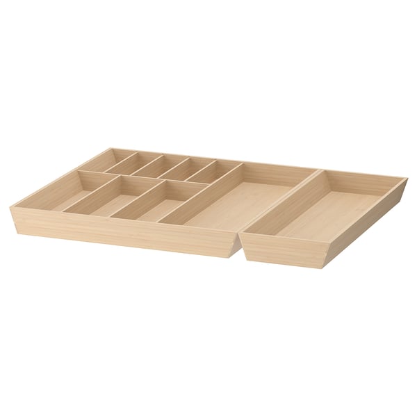 Un plateau de rangement en bois de bambou UPPDATERA avec plusieurs compartiments. Couleur brun clair, de forme rectangulaire, divisée en sections pour le tri des articles.