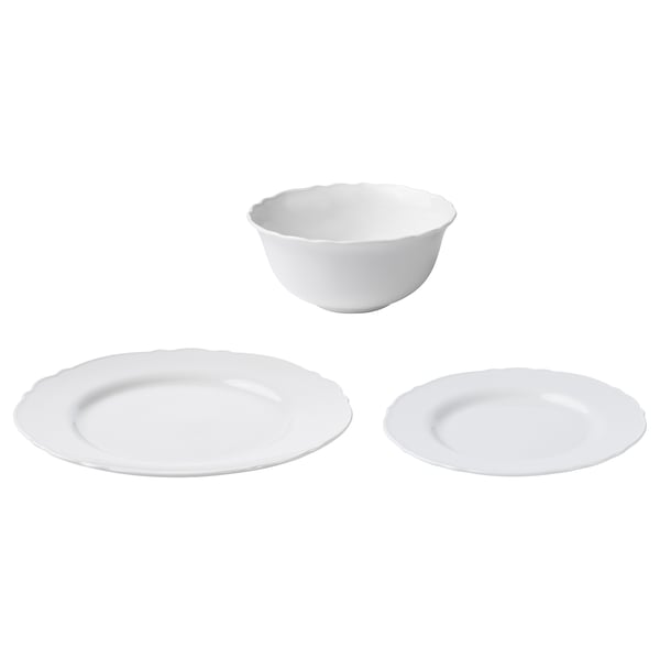 Trois pièces de vaisselle en porcelaine UPPLAGA blanche : un bol et deux assiettes à bords volantés.