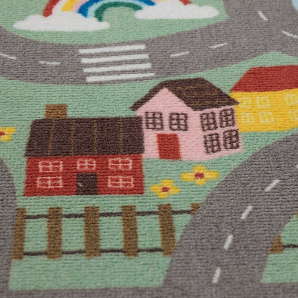 Tapis vibrant et confortable avec des motifs de maison ludiques, parfait pour les jeux des enfants.