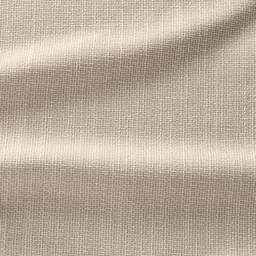 Gros plan sur le tissu texturé, beige clair avec un motif de tissage subtil, aspect doux et durable.