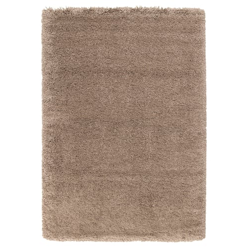Tapis à poils longs beige VOLLERSLEV, doux et texturé, rectangulaire avec surface moelleuse.
