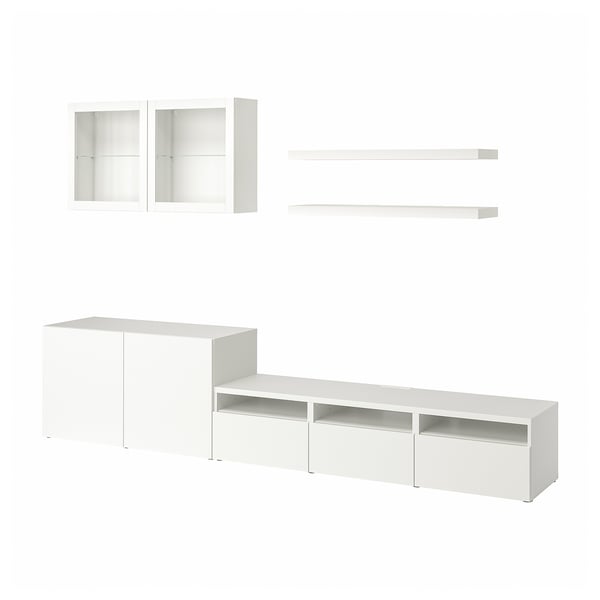 IKEA BESTÅ witte opbergset: tv-bank, glazen deurkast, wandplanken. Modern, strak ontwerp voor opslag in de woonkamer.