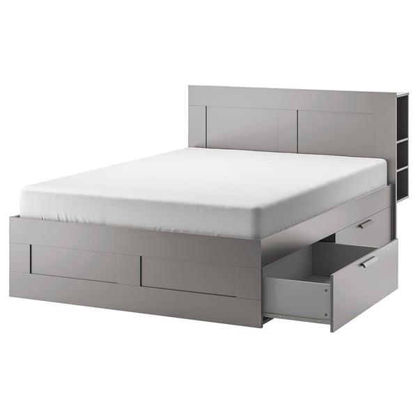 Modern grijs bed met minimalistisch design, ingebouwde opberglades en verstelbare planken aan het hoofdeinde.