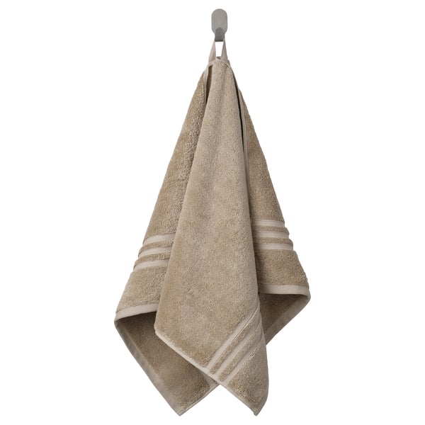 BROKGLIM handdoek, beige, biologisch katoen, gevouwen, elegante rand.