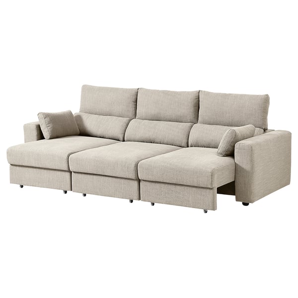 Een ESKILSTUNA bank in beige, met een hoge rugleuning, verstelbare hoofdsteunen en een uitschuifbare chaise longue.
