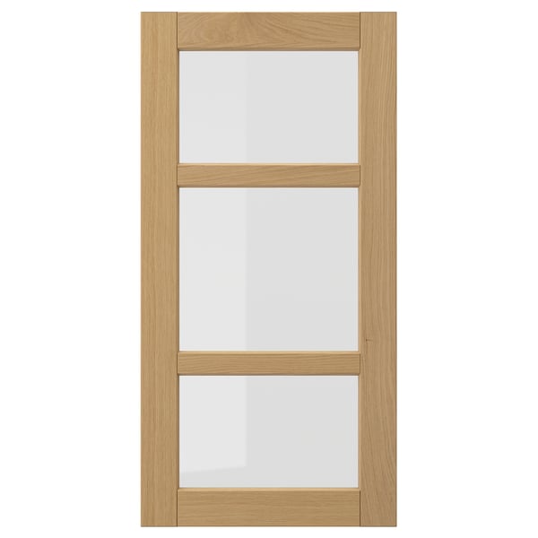 Forsbaka keukenkast met eikenhouten frame en glazen panelen.