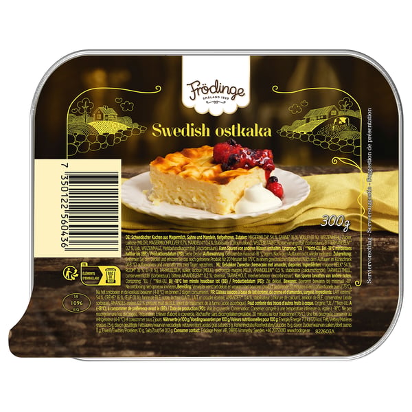 FRÖDINGE zweedse ostkaka verpakking. Dessert op plaat. Gouden etiket met boerderijafbeeldingen.