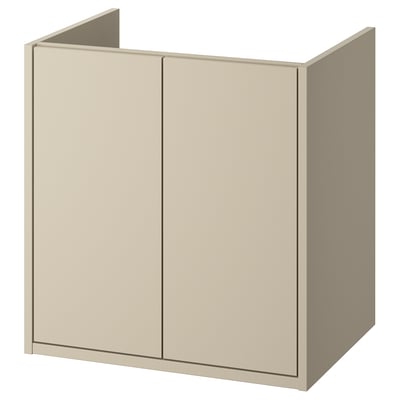 Het HAVBÄCK beige badkamermeubel met twee deuren, een eenvoudig en strak ontwerp en een optie voor wandmontage.