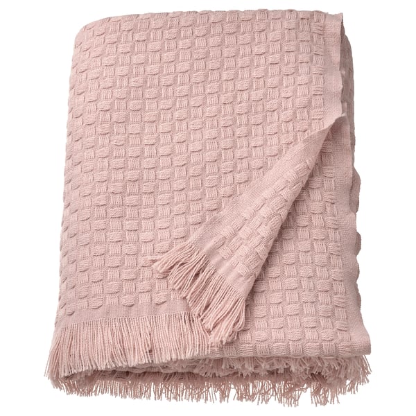 Lichtroze HORNMAL deken, gefranjerde, geweven textuur, 100% gerecycled polyester.