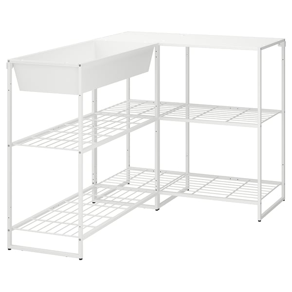 Een wit JOSTEIN opbergrek met drie planken en een lade, ontworpen voor zowel binnen- als buitengebruik.
