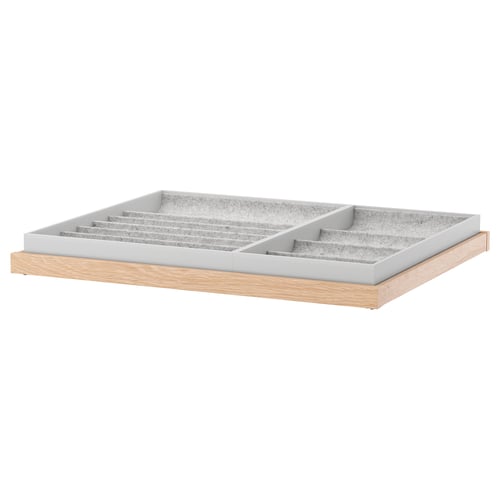 KOMPLEMENT uittrekbare lade met vilten inzet voor het ordenen van accessoires. Houten voet, grijs vilt, rechthoekige vorm.