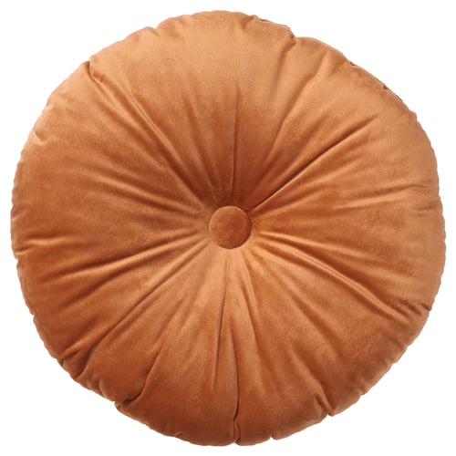Rond, oranje kussen met geplooid ontwerp voor gezellig comfort.