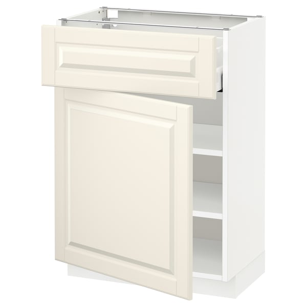 Een witte METOD keukenkast met een gebroken witte deur en lade. Het heeft een traditioneel ontwerp met afgeschuinde randen en een enkele verstelbare plank aan de binnenkant.