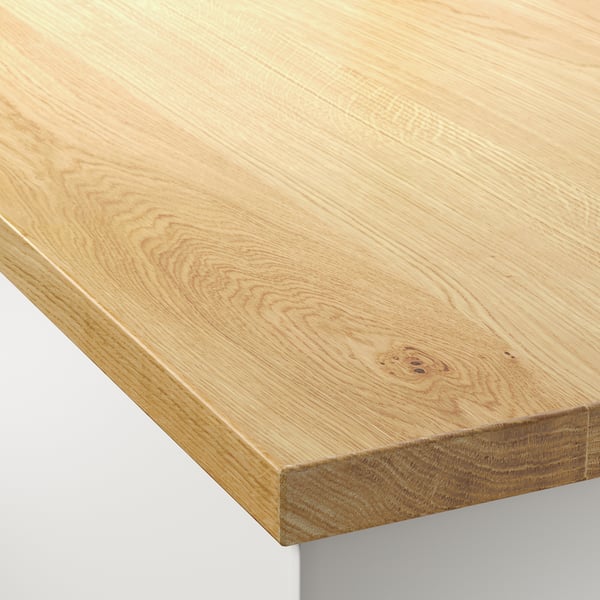 Tafelblad van natuurlijk hout getoond, gladde afwerking, lichte nerf zichtbaar, afgeronde hoeken.
