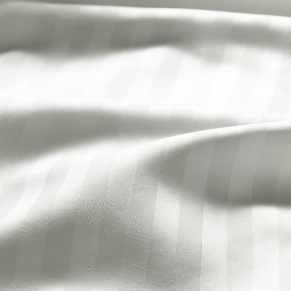 Gestreepte laken close-up, gladde textuur.