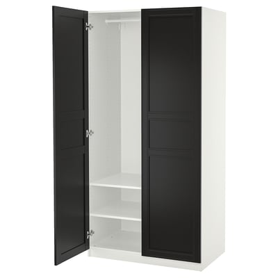 Ikea PAX kledingkast, wit en zwart, rechthoekig, slank ontwerp, twee deuren, een plank binnen, zachtsluitende scharnieren.