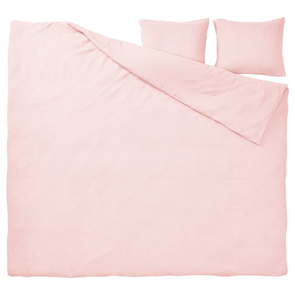 Lichtroze bedset, biologisch katoen, glad met subtiele textuur, inclusief dekbed en twee kussens.