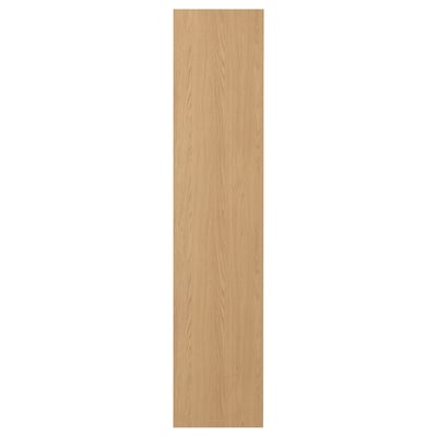 Een STORKLINTA houten deur in lichtbruin. Het heeft een strak, rechthoekig ontwerp met een moderne, minimalistische uitstraling.