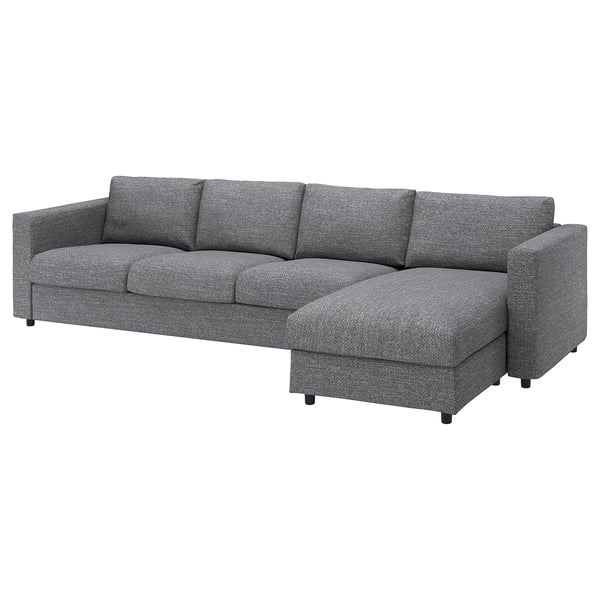 Een grijze VIMLE sectionele bank met rechts een chaise longue. Het is modern, comfortabel en biedt veelzijdige zitplaatsen.