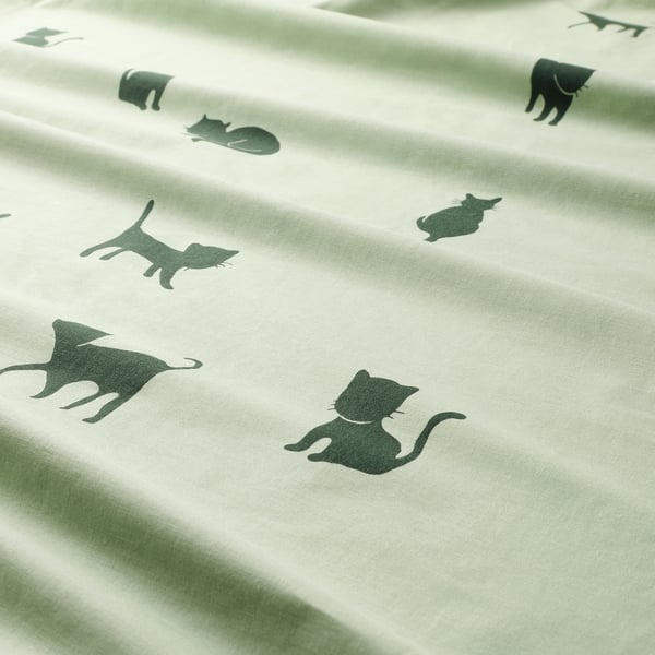Black cat silhouettes on light green, soft fabric; cosy duvet cover.