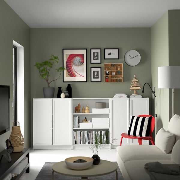 Modern living room with BILLY bookcase as a sideboard, displaying books, décor items, and a tv.