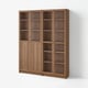 Wooden BILLY bookcase with multiple shelves, divided into five sections, four with glass doors, light brown colour.