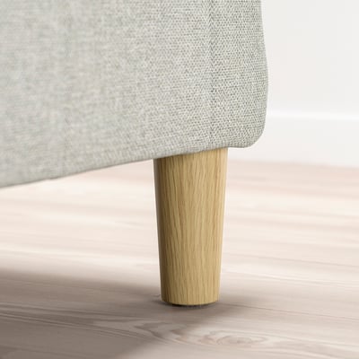 Light grey upholstered bed leg, made of solid wood, 12. 5 cm high.