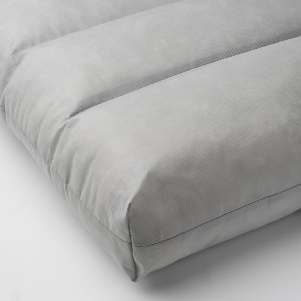 Plush, light grey cushion, neatly stitched, showing soft and supportive texture.