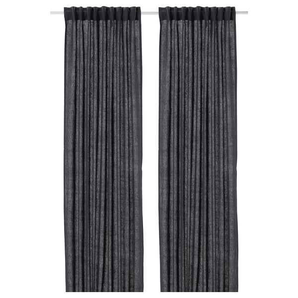 Two grey linen curtains hang side by side, featuring simple, dark colour and natural texture.