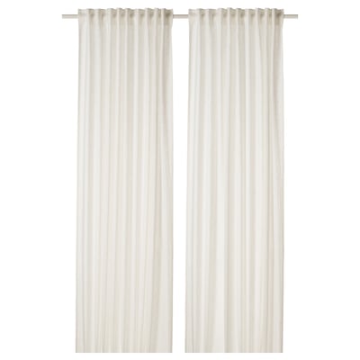 White linen curtains hang straight, offering privacy with sheer fabric.