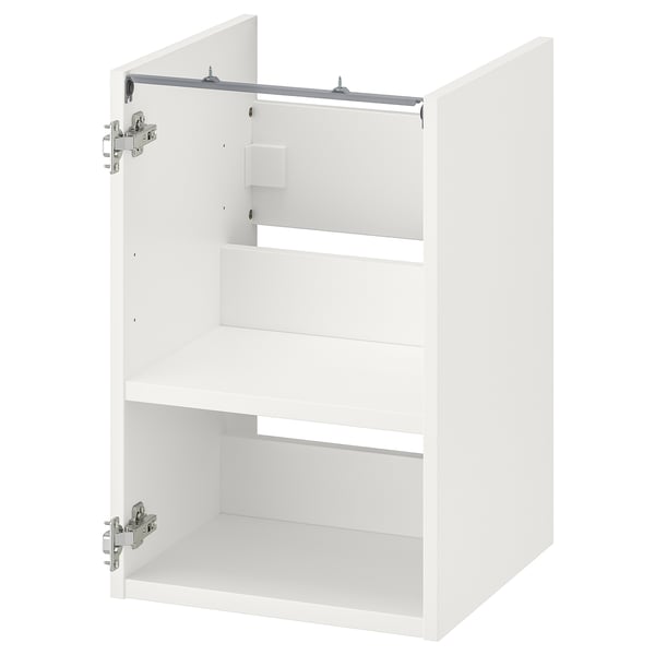 Depicts a white ENHET bathroom cabinet with one open door, revealing a shelf inside.
