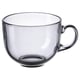 Single, transparent grey glass cup with small handle, round shape.