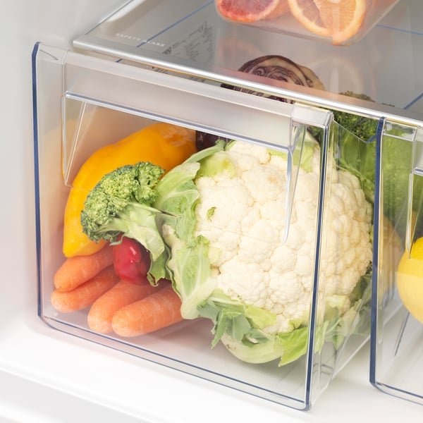 Clear fridge drawer stores vegetables, keeping them fresh.