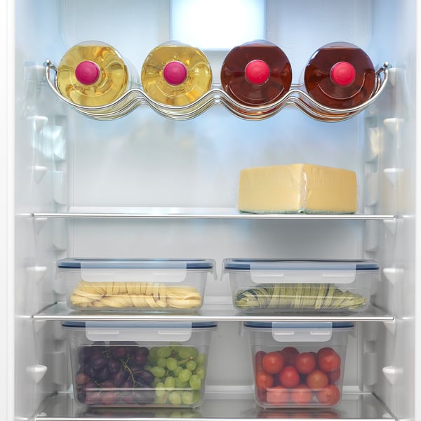 Fridge with adjustable shelves, spill guards, led light, and a no frost system keeps food fresh. Stylish, integrated design.
