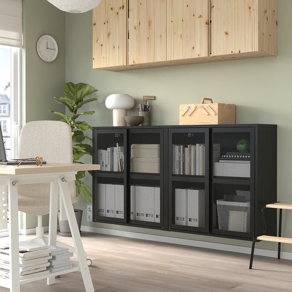 Home office with IVAR storage, desk, chair, plant.