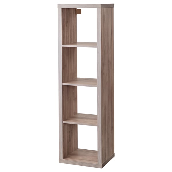 A KALLAX shelving unit in light grey, made of particleboard and paper foil. It stands vertically with multiple open shelves.